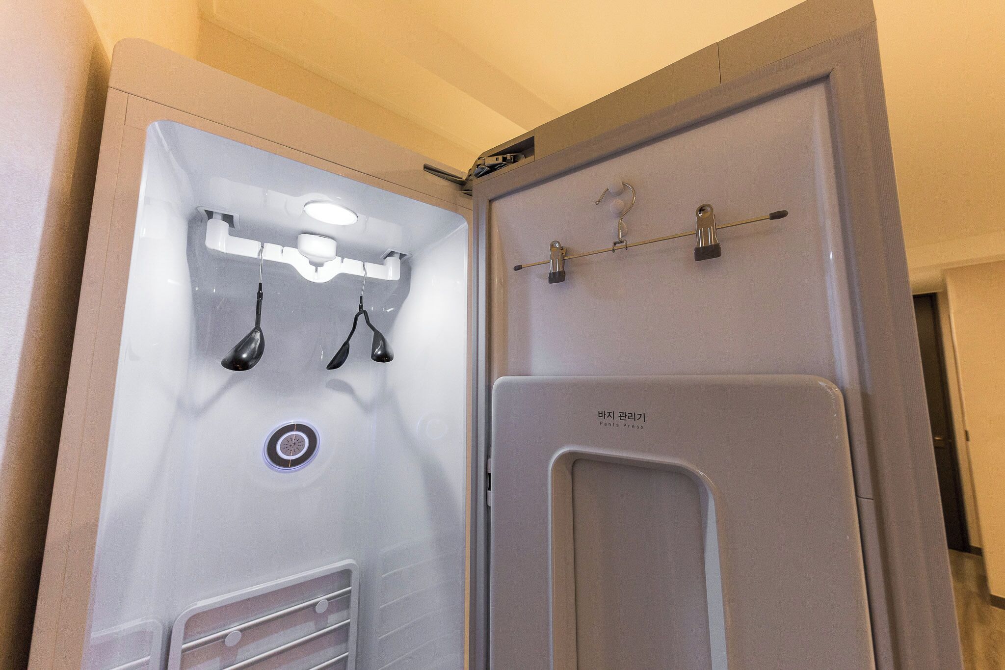 A bathroom with a shower, a toilet, and a sink.