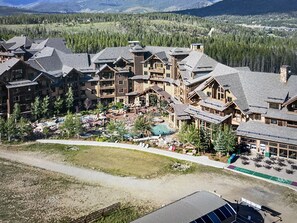 Surrounded by trees and mountains, this lodge offers a serene retreat with a mix of natural beauty and rustic charm.