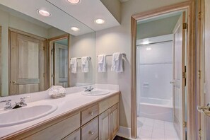 Bathtub, hair dryer, towels, soap