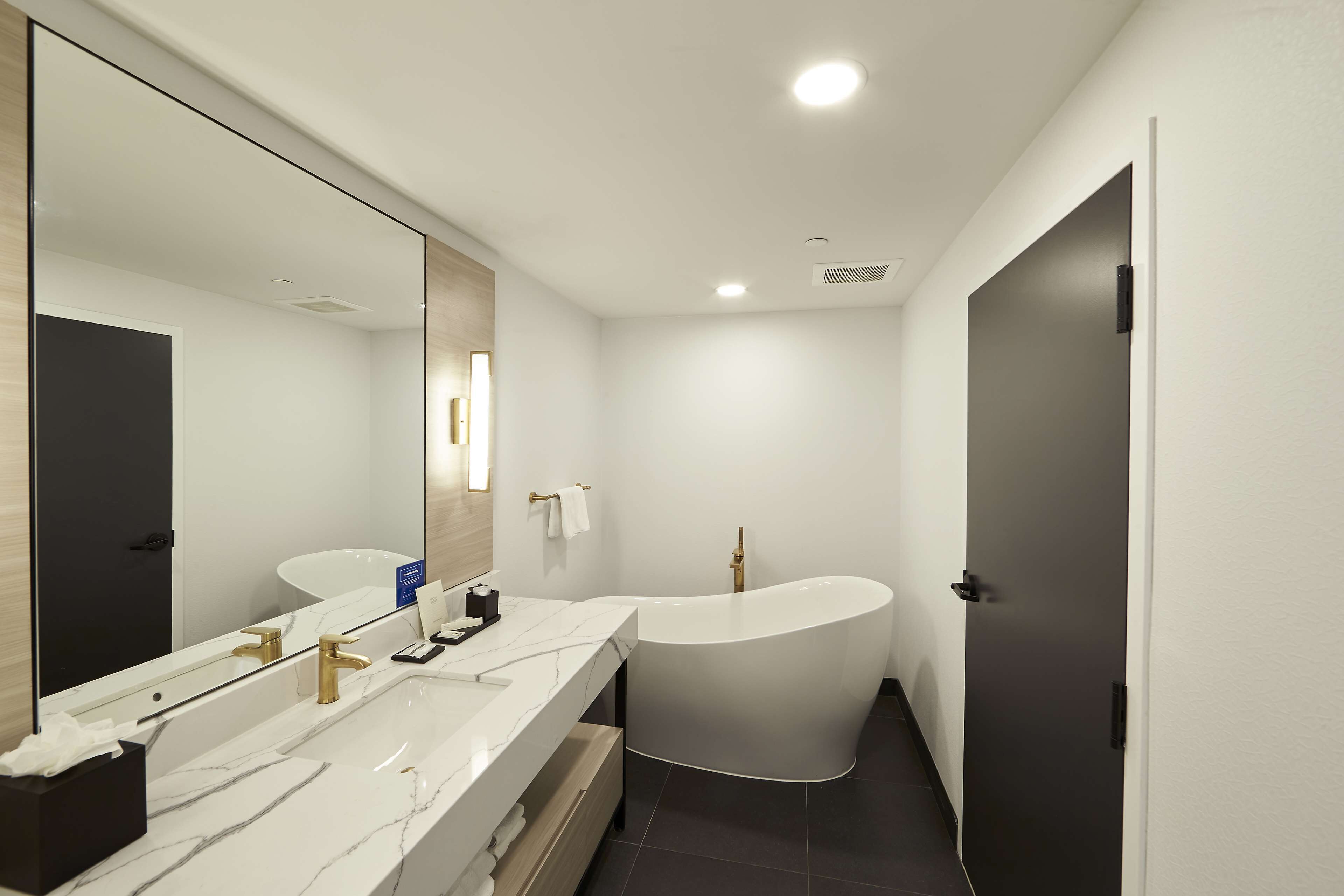 designer toiletries, hair dryer, towels, soap