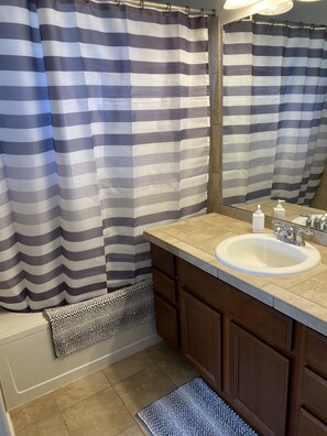 Combined shower/bathtub, hair dryer, towels, soap