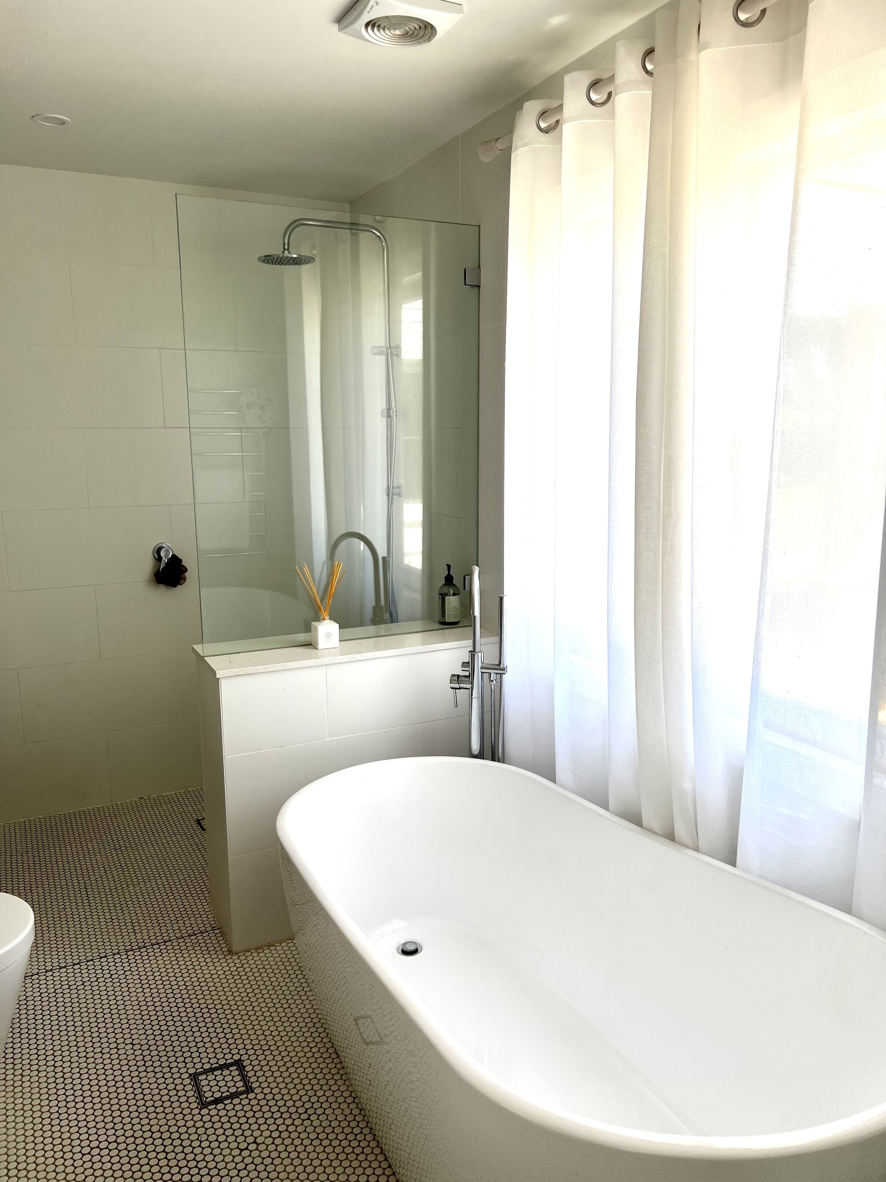 Bathtub, hair dryer, towels, soap