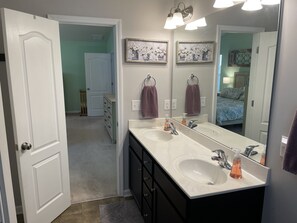 Combined shower/tub, hair dryer, towels, soap