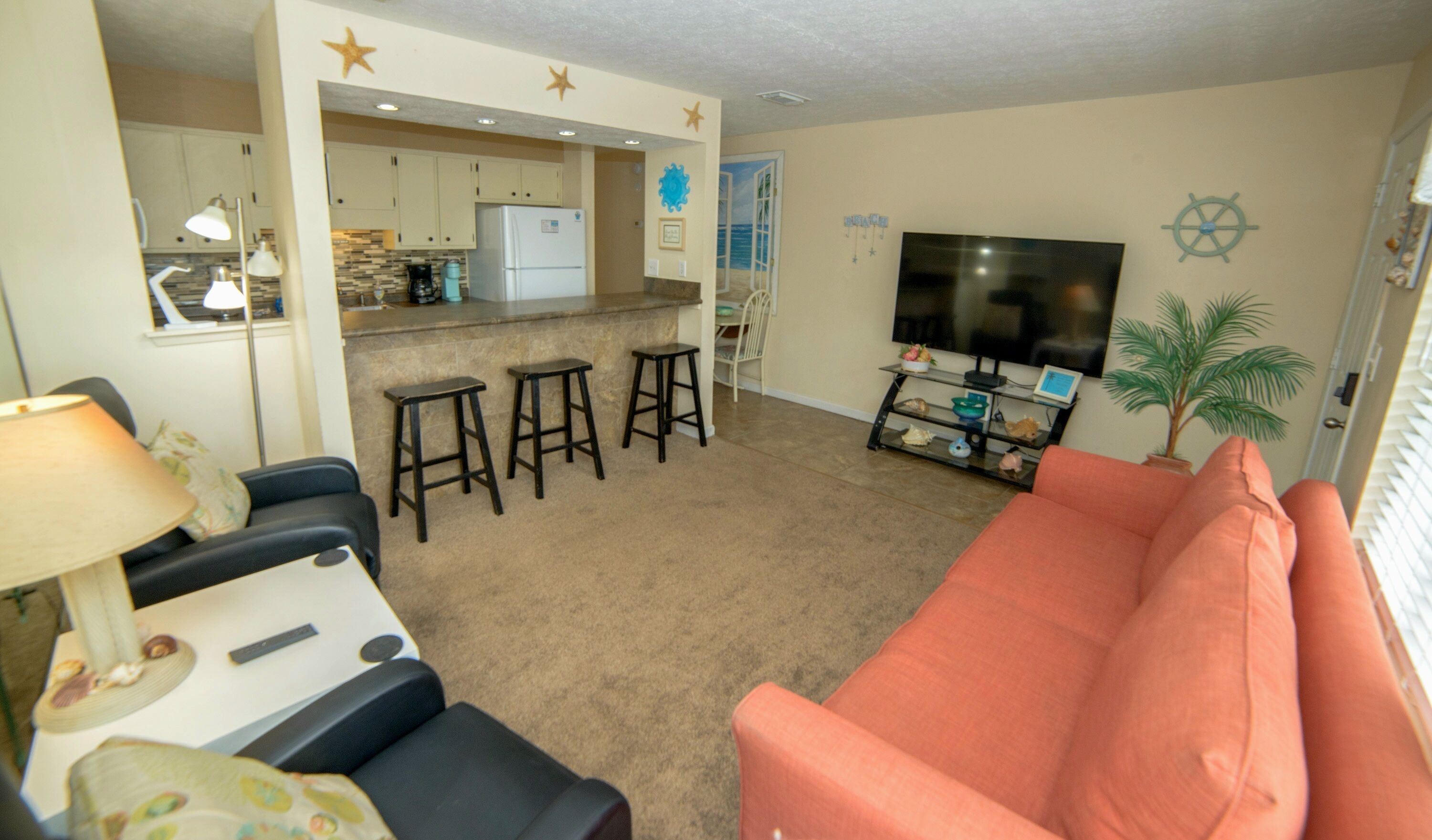 Charming 1Br Condo on the beach with pool outside back door and beach access.