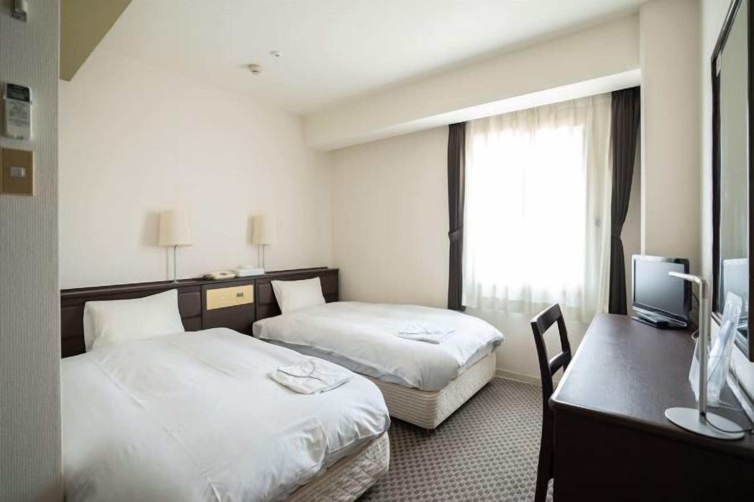 Desk, laptop workspace, free WiFi, bed sheets