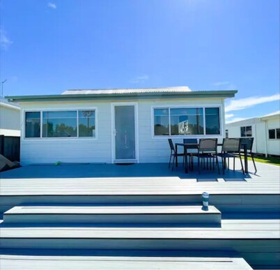 Lakeside House Tuncurry with deck overlooking the lake