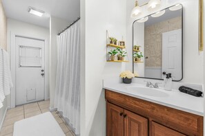 Combined shower/tub, hair dryer, towels, soap