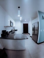 Fridge, microwave, stovetop, coffee/tea maker