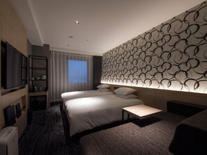 Tvåbäddsrum Deluxe | Duntäcken, bäddmadrasser, skrivbord och ljudisolering