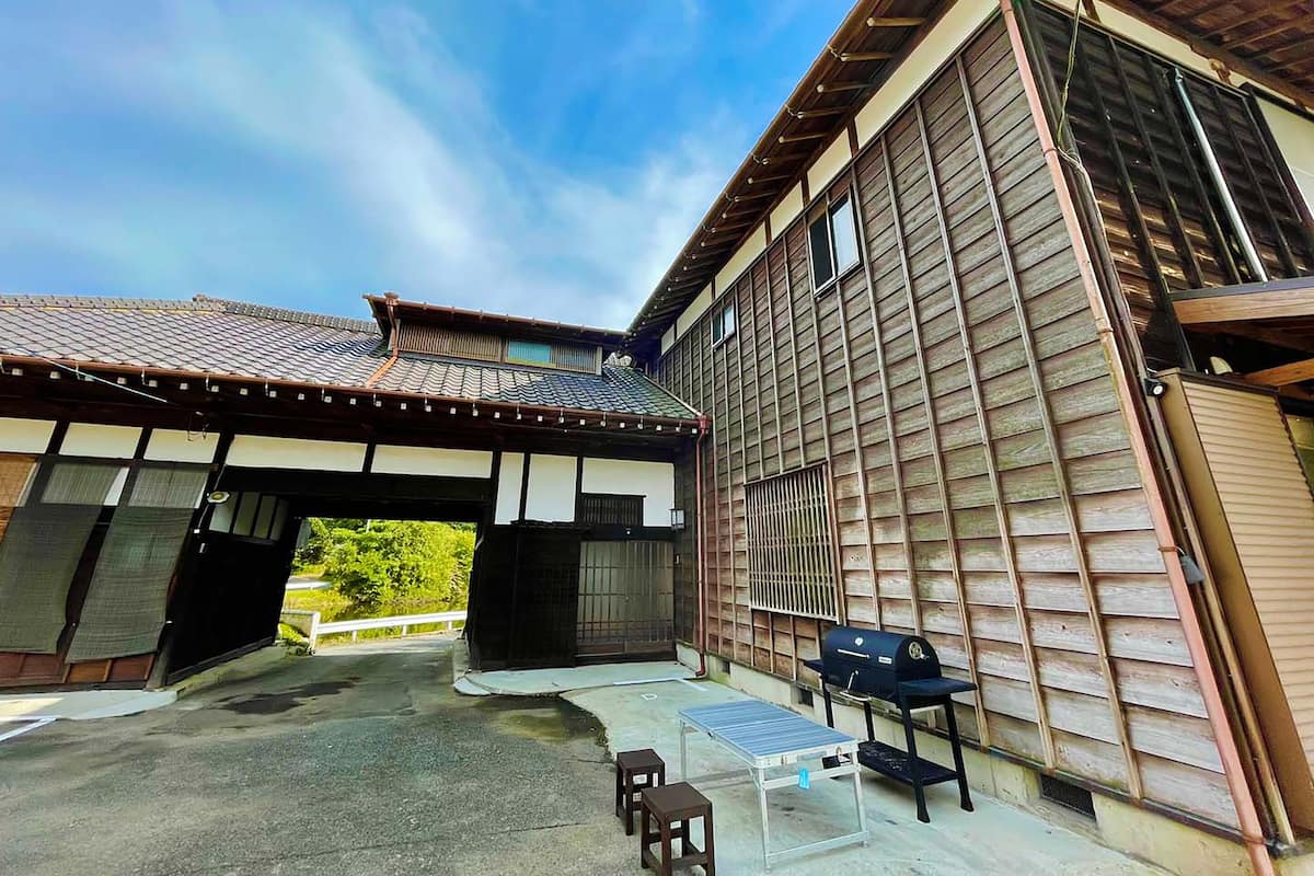 A traditional Japanese-style building with a tiled roof and wooden walls.