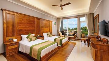 Departamento Deluxe, 2 habitaciones, vista al mar | Ropa de cama de alta calidad, edredón, camas Tempur-Pedic y minibar