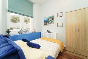 Apartamento, 1 cama King e sofá-cama | 2 quartos, ferros/tábuas de passar roupa, Wi-Fi de cortesia
