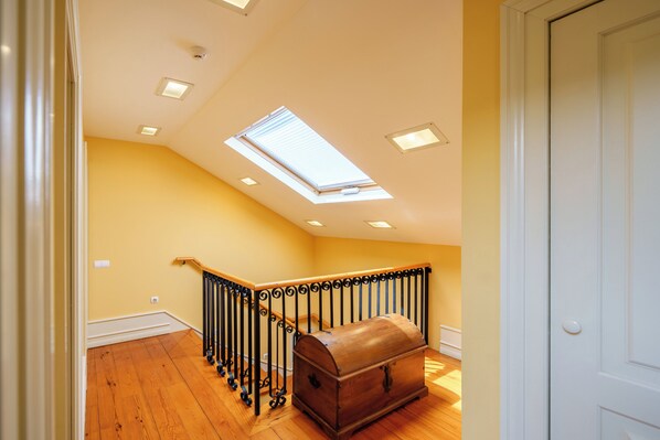 Enjoy the airy feel of this room with a skylight and wooden floor.