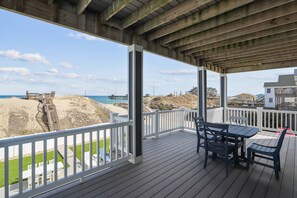 Outdoor dining - Pier View Oasis - Nags Head MP 16, Oceanfront, Elevator, Theater, Pool, Hot Tub, Pets OK (Nags Head)