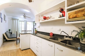 Fridge, microwave, stovetop, coffee/tea maker