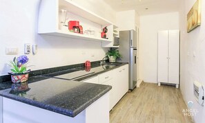 Fridge, microwave, stovetop, coffee/tea maker