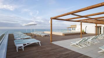 Seasonal outdoor pool, pool umbrellas, sun loungers