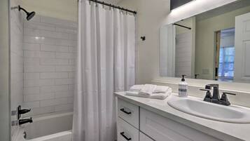 Combined shower/bathtub, towels, soap