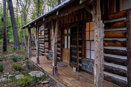 Exterior detail. Woodsy Cabin Guest House with Spa and Pickleball Court.