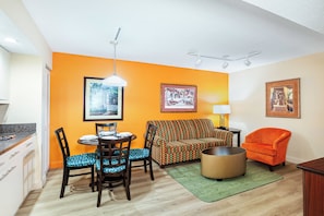 A compact living space with a dining area, a sofa, and a chair. - Vacation Village at Bonaventure (Weston)