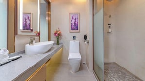 A modern bathroom with a large mirror, a white sink, a toilet, and a shower area. - Lavande Hotel (Shenzhen Airport Fuyong Metro Station) (Shenzhen)