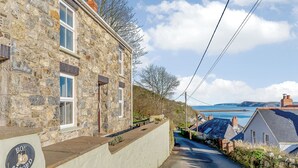 A stone building with a white exterior wall and a sign reading "Bon Accord". - Picked for its wonderful character and charm and stunning sea views to enjoy. (Goodwick)