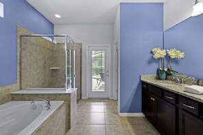 Bathtub, hair dryer, towels, soap