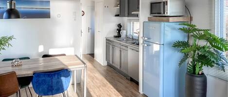 Fridge, stovetop, dishwasher, coffee/tea maker