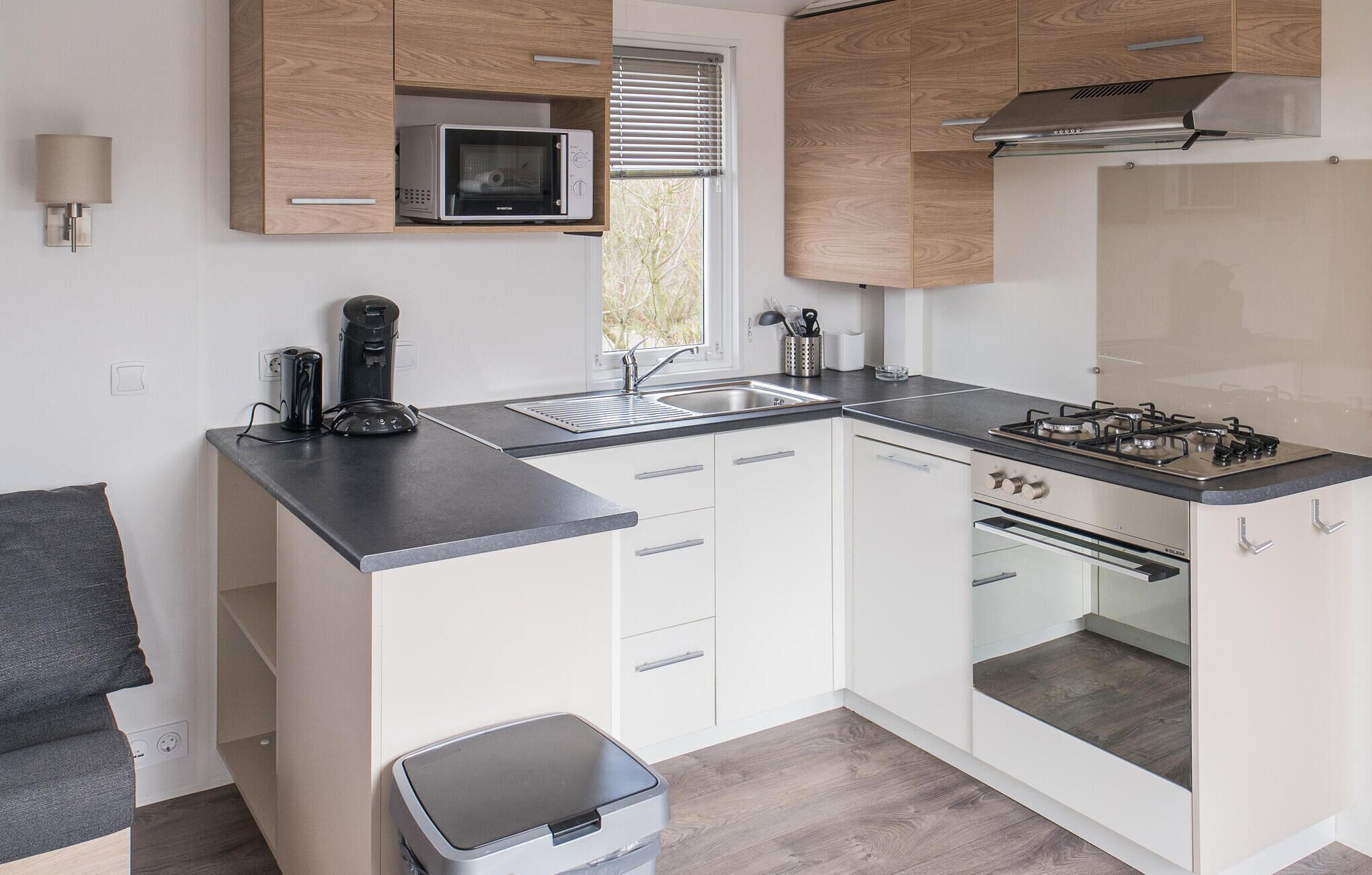 Fridge, stovetop, dishwasher, coffee/tea maker