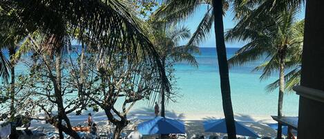On the beach, sun loungers, beach towels