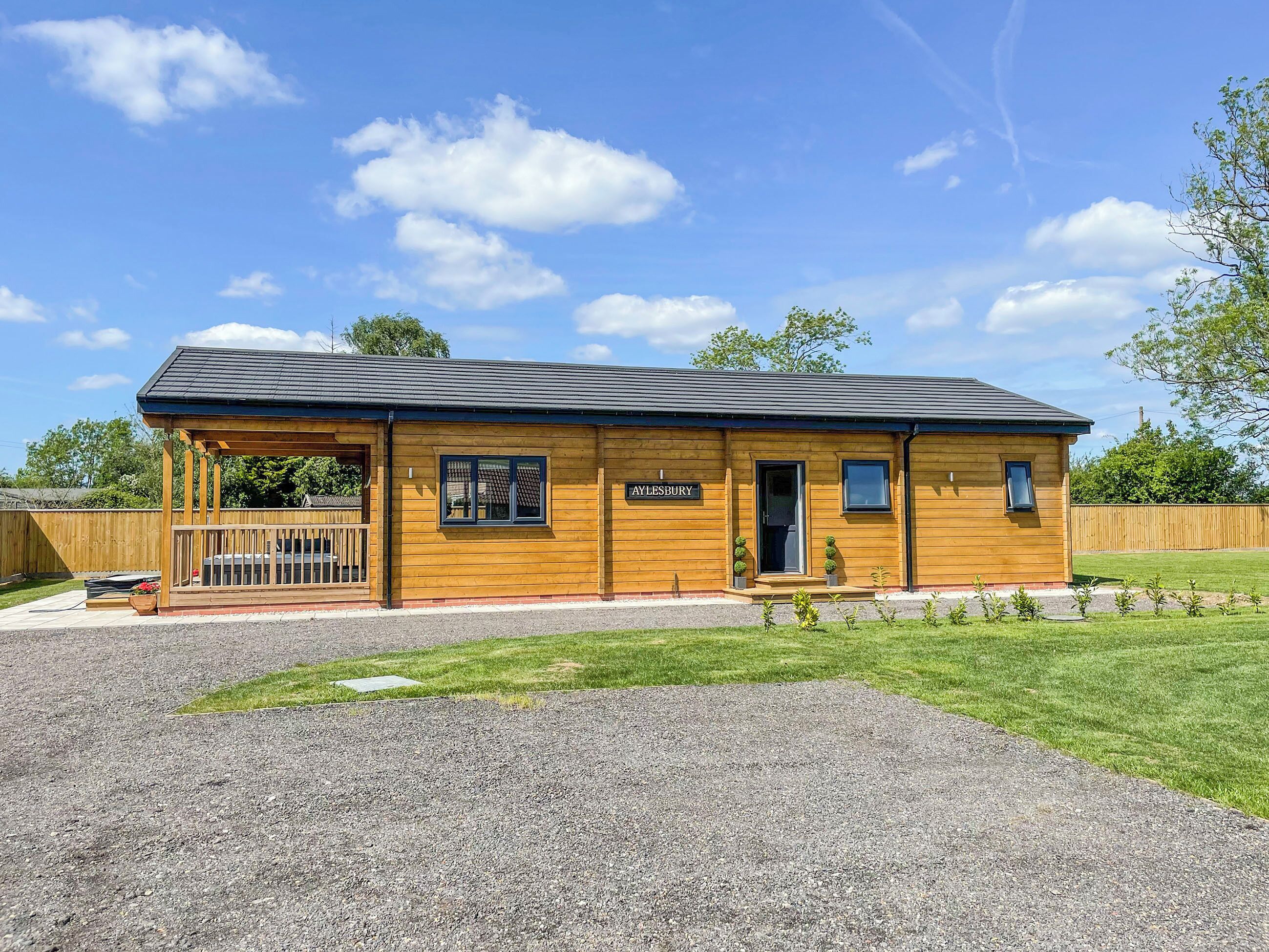 A wooden building with a sign reading "Maylesbury."