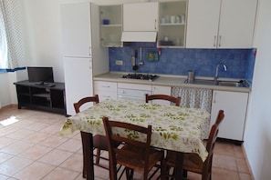 Fridge, oven, dining tables