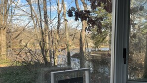 A framed sign with the text "welcome sit, relax, enjoy" on a window sill. - The Lakeside Cottage in Stow! (Stow)