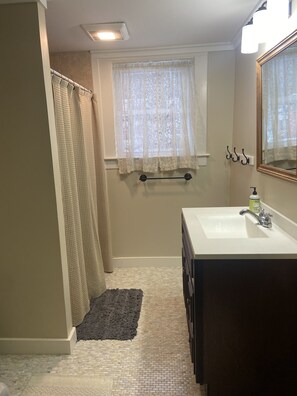 Shower, hair dryer, towels, soap