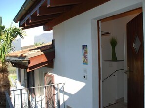 Enjoy a balcony with a door leading to a cozy interior space.
