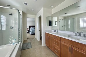 Combined shower/tub, hair dryer, towels, soap