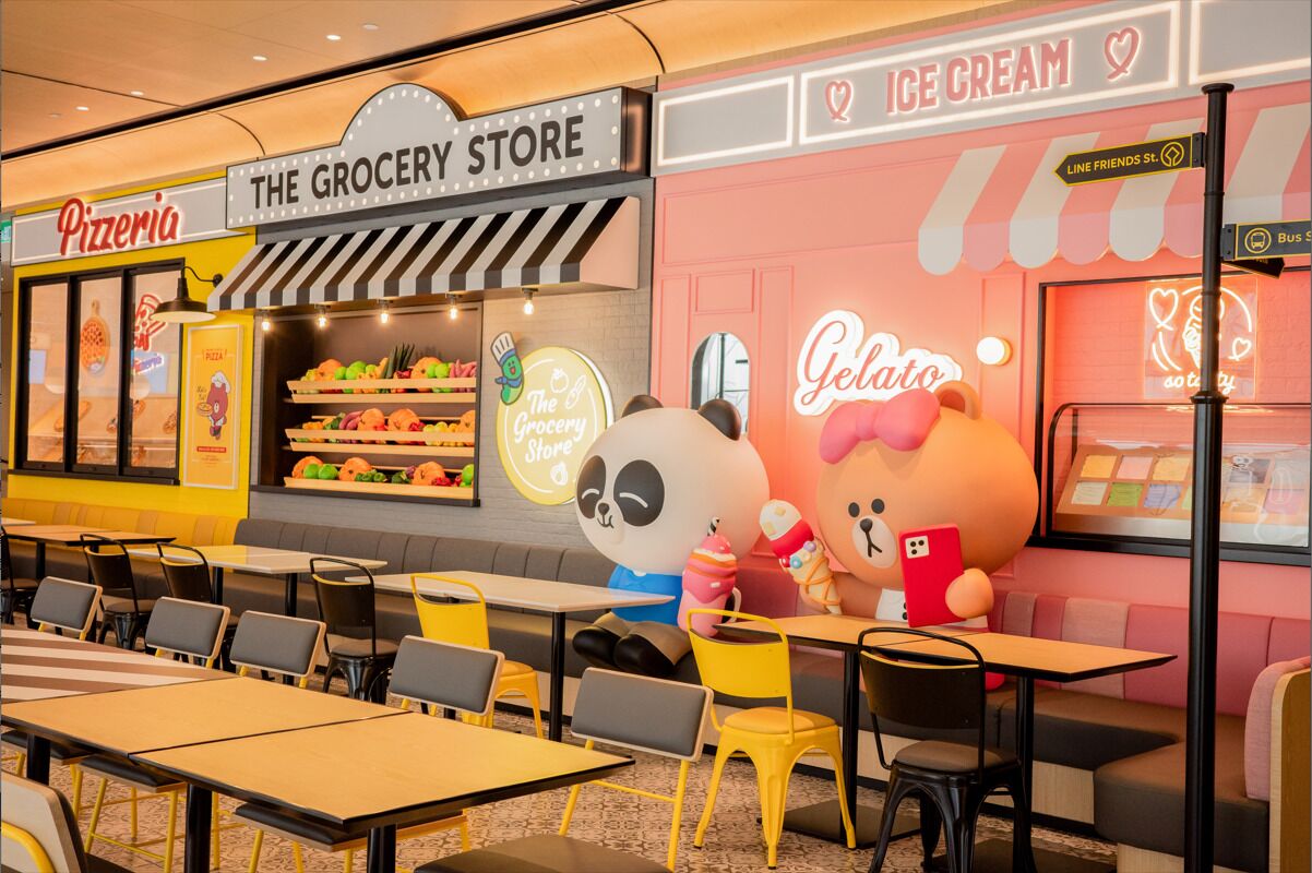 A restaurant with a grocery store, ice cream, and a panda mascot.