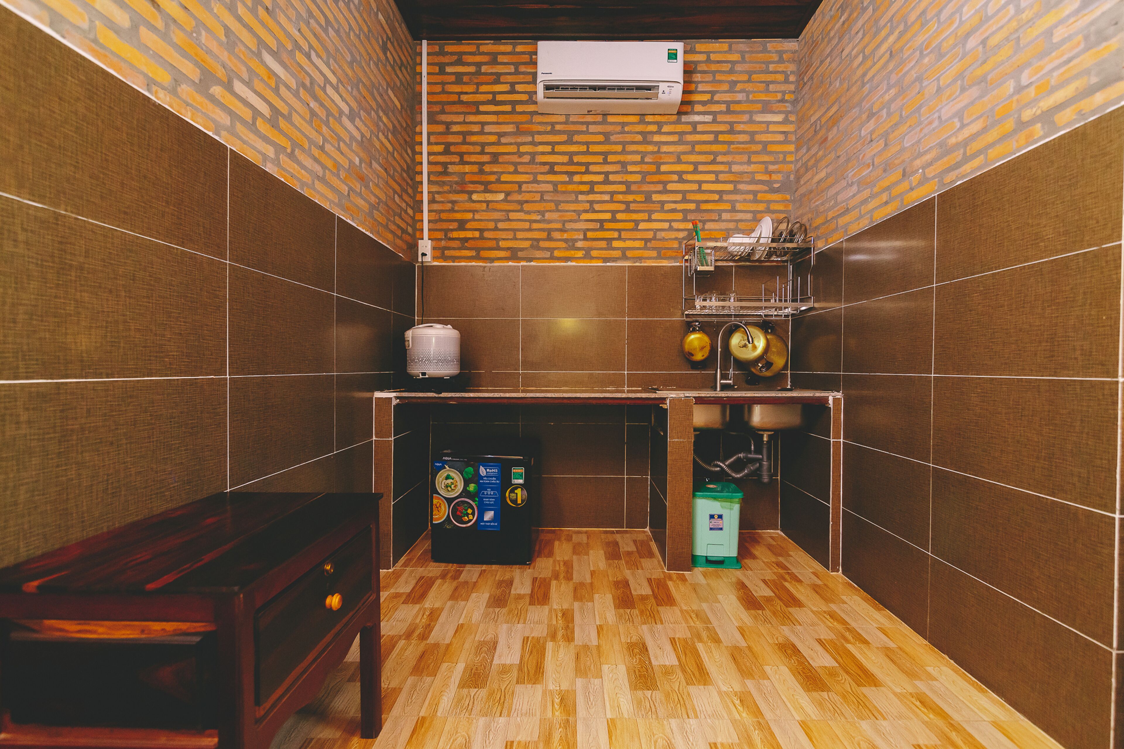 mini-fridge, stovetop, rice cooker, cookware/dishes/utensils