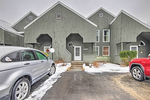 A row of grey wooden townhouses with a central entrance and a driveway. - Near Newfound Lake: Plymouth Condo w/ Fireplace! (Plymouth)
