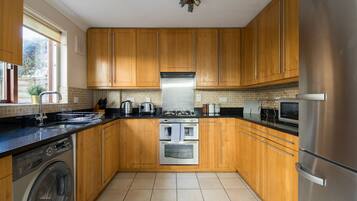 Apartment | Private kitchen | Full-size fridge, microwave, oven, stovetop
