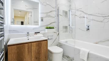 Separate bathtub and shower, hair dryer, towels, shampoo