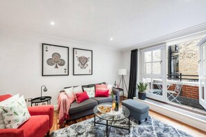 Apartment, Mehrere Betten | Wohnzimmer