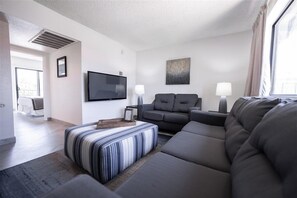 Apartment, 1 Bedroom | Living area | TV, fireplace