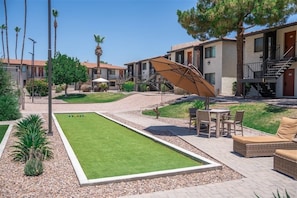 Relax in our serene courtyard, surrounded by lush greenery and comfortable outdoor seating.