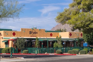 Regal's Pizza Bistro offers outdoor seating with umbrellas.