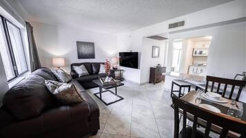 Apartment, 1 Bedroom | Living area | TV, fireplace