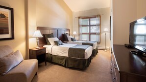 A hotel room with two beds, a TV, a desk, and a chair. - Zephyr Mountain Lodge, Condo | Ski-In/Ski-Out Continental Divide Views (Value-Rated Condo 2202) (Winter Park)