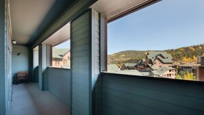 A balcony with a view of a town and mountains. - Zephyr Mountain Lodge, Condo | 2 bedroom, Gas Fireplace & Continental Divide Views (Premium Rated Condo 1701) (Winter Park)