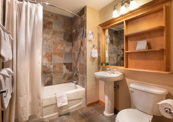 A bathroom with a bathtub, a sink, and a toilet. - Zephyr Mountain Lodge, Condo | 2 Bedroom (Select-Rated Condo 1415) (Winter Park)