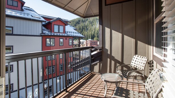 A balcony with a view of neighboring buildings and a mountain. - Fraser Crossing/Founders Pointe, Condo | Gondola Access (Premium-Rated Condo 3624) (Winter Park)